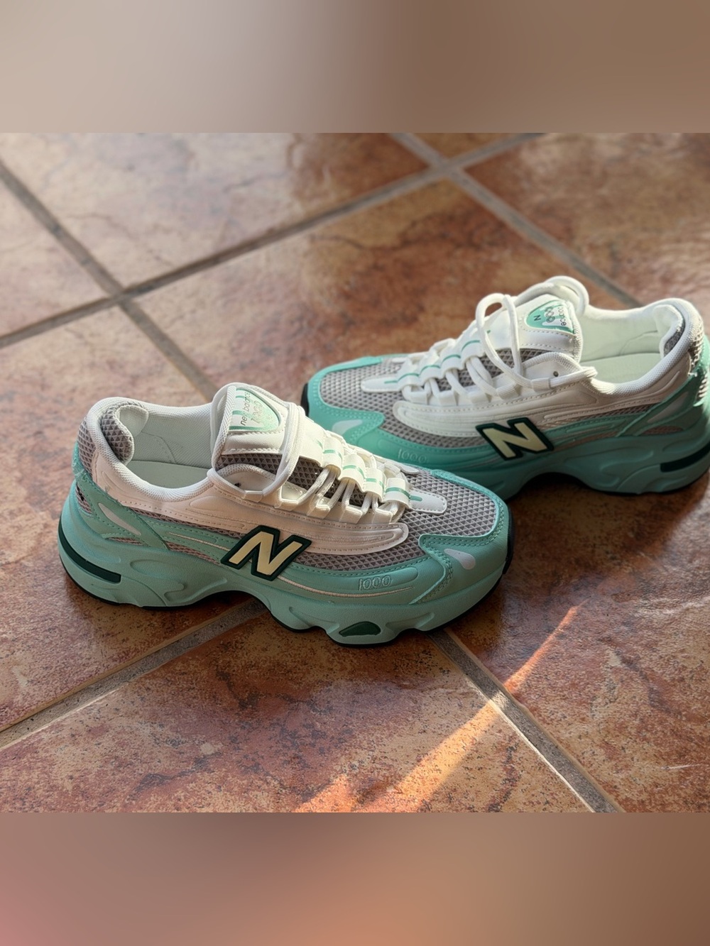 Size Men’s 6.5 And Women’s 8 - New Balance 1000 Turquoise and White
